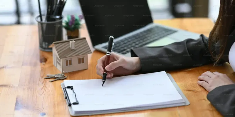 Home-loan paperwork and a pen ready for an ARM disclosure review