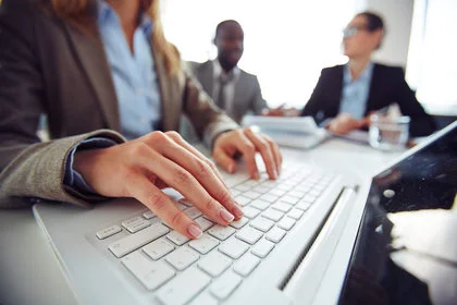 Person comparing mortgage rates on laptop computer